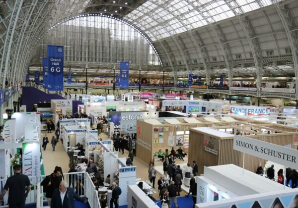 Busy exhibition hall with many booths and attendees