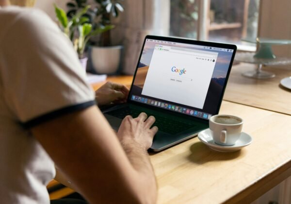 person using black laptop computer