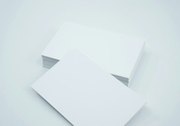 two blank paper sheets on a white background