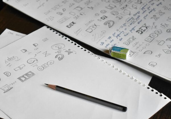 a pencil sitting on top of a pile of paper
