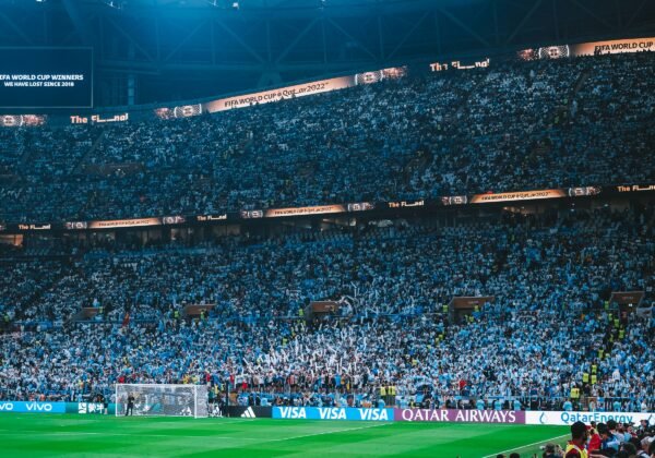 a stadium full of people watching a soccer game