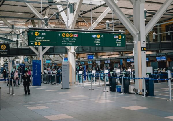 a group of people standing around a terminal