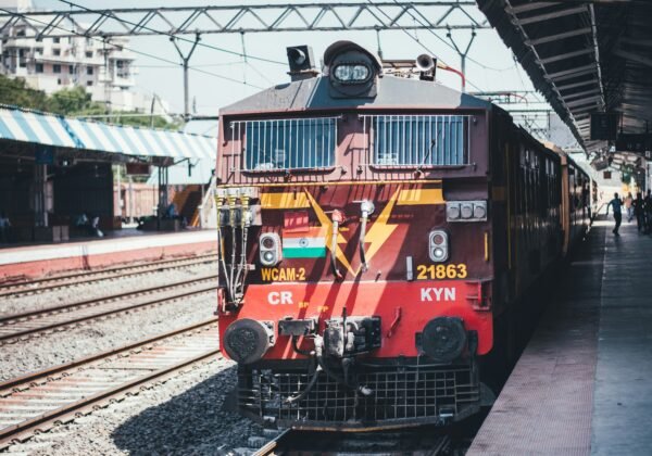 red train on a station platform